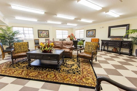 a living room with a checkered floor and furniture