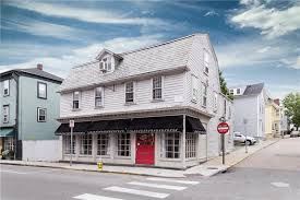 a white house on the corner of a street