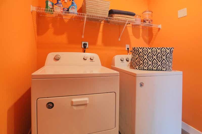 a bathroom with a sink and a washing machine