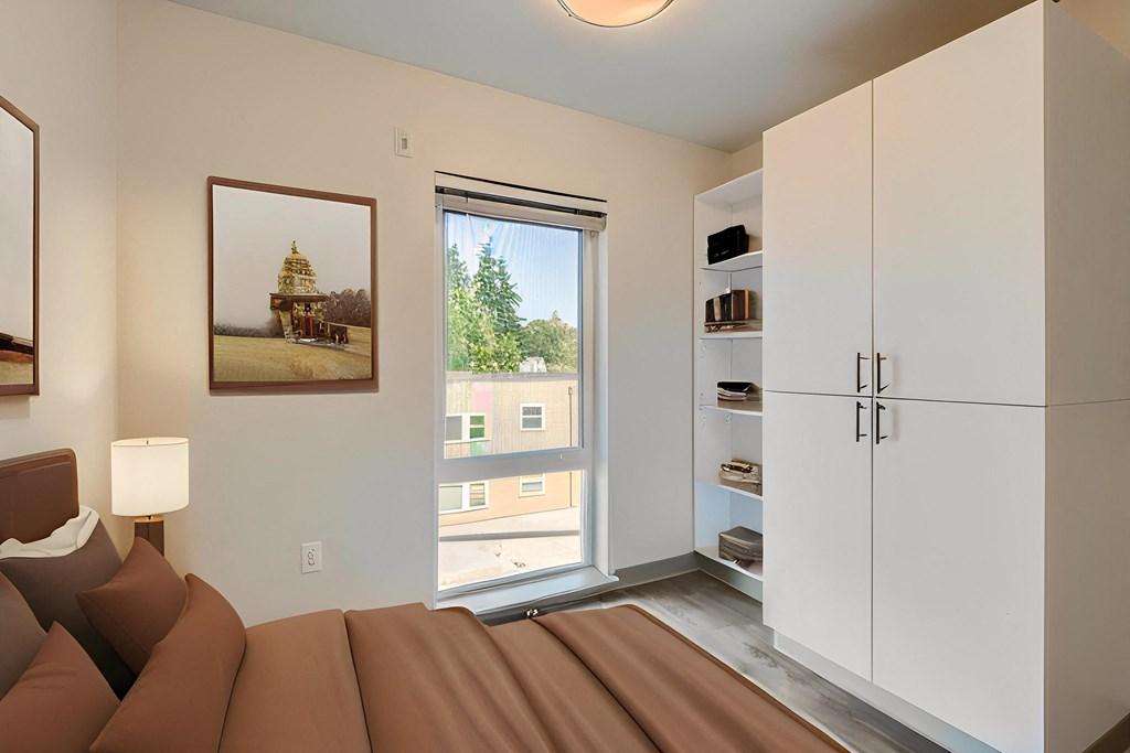 a living room with a couch and a window