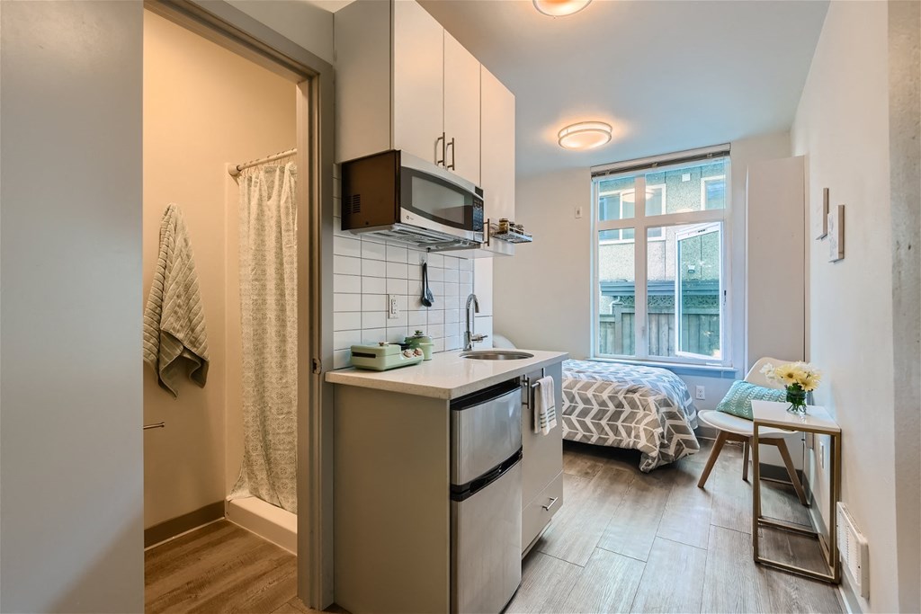 a small kitchen with a sink and a microwave