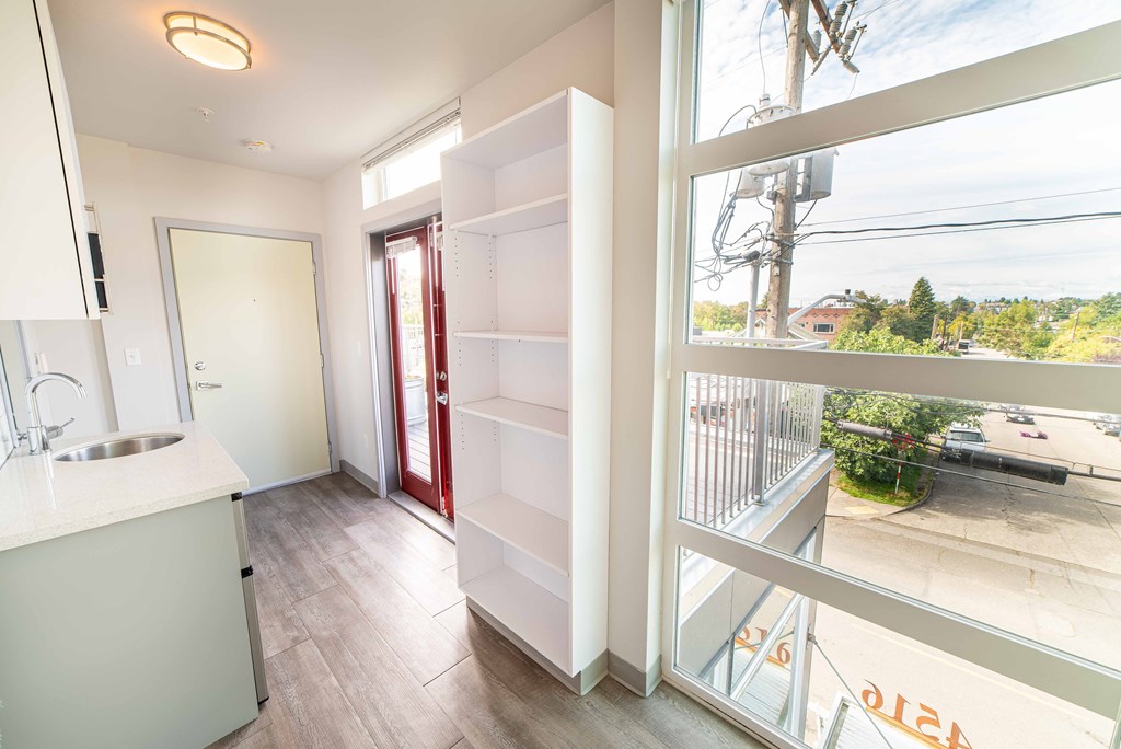 a kitchen with a large window and a sink