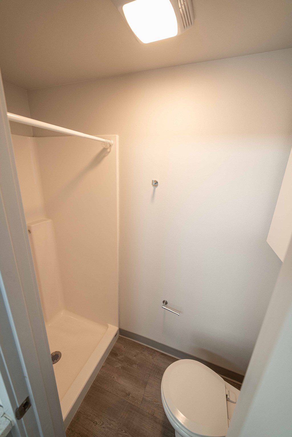 a small bathroom with a toilet and a shower