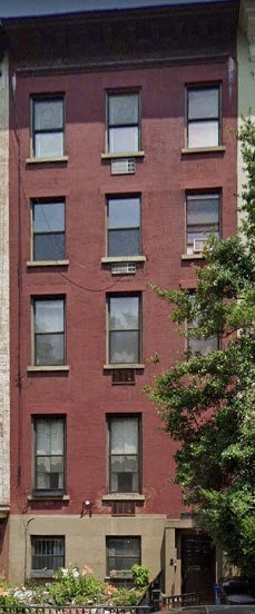 a red brick building with many windows on it