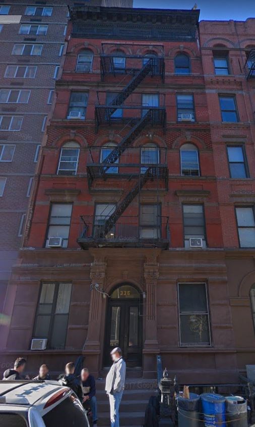 a tall building with a fire escape on the side of it