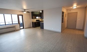 Beautiful living space flooded with natural light at Archer Tower in Denver, CO
