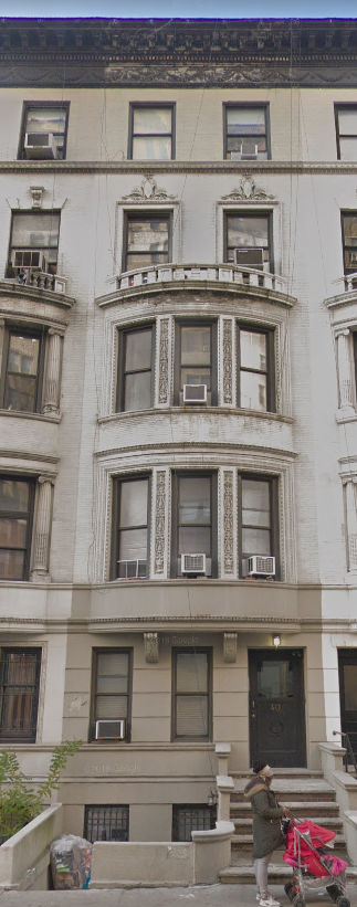 a person is standing on the steps of a building