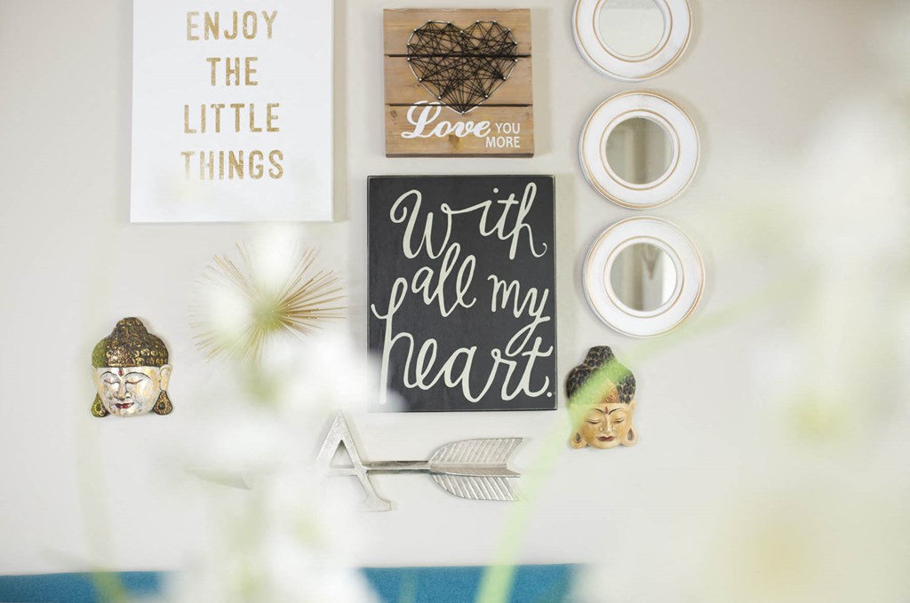 a white table with art and other items on it