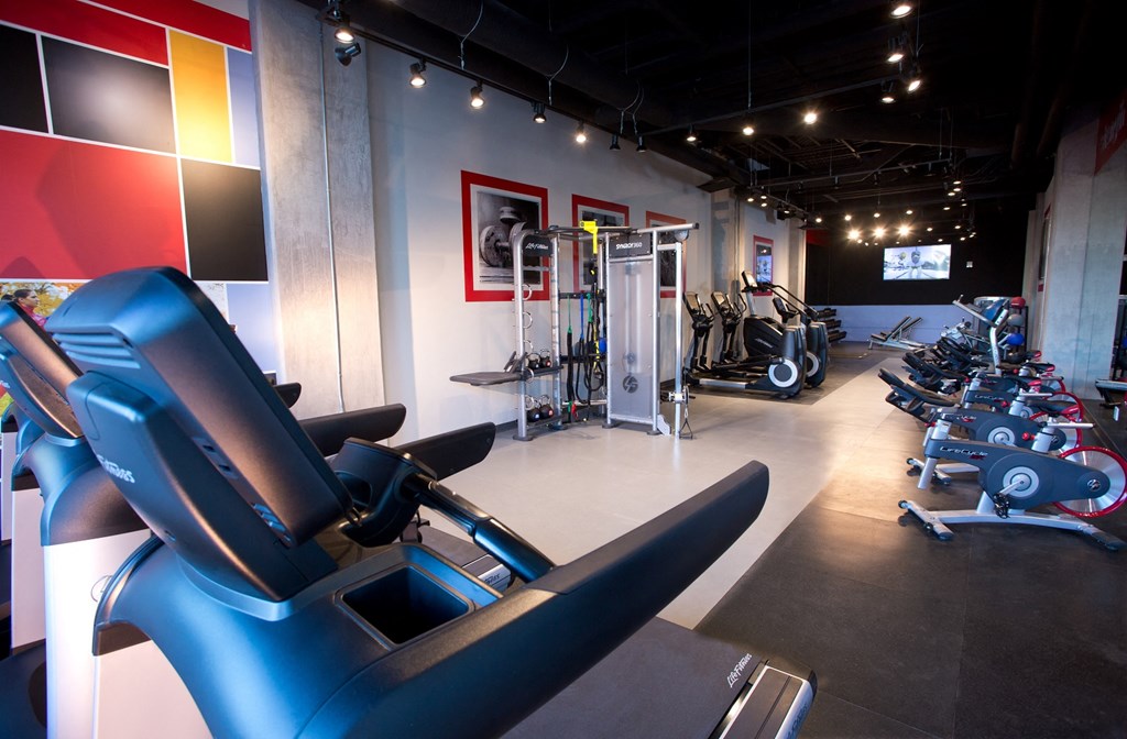a gym with a variety of exercise equipment