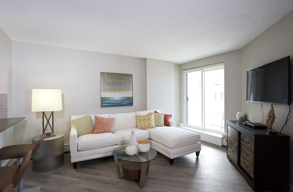 a living room with a couch and a table and a tv