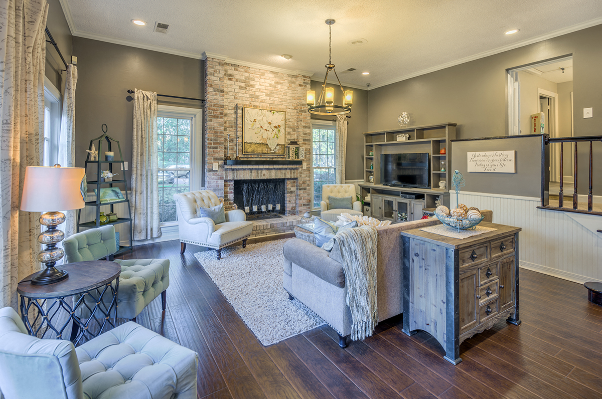 a living room with a fireplace and a couch