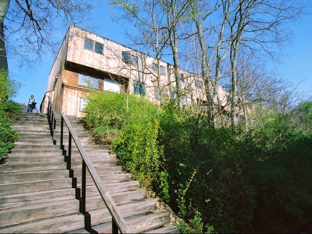 a house with a staircase and a person walking up the stairs