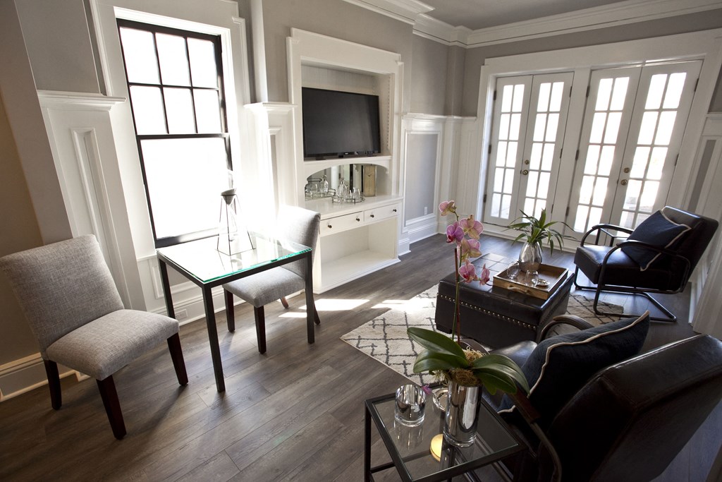 a living room filled with furniture and a television