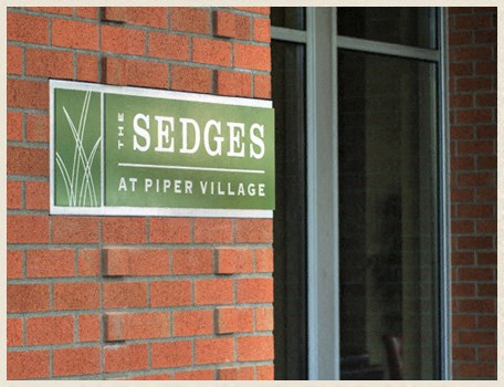 a sign on the side of a brick building