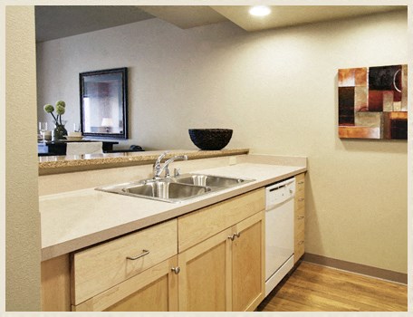 a kitchen with a sink and a counter top