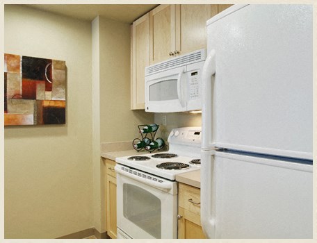 a kitchen with a stove microwave and refrigerator