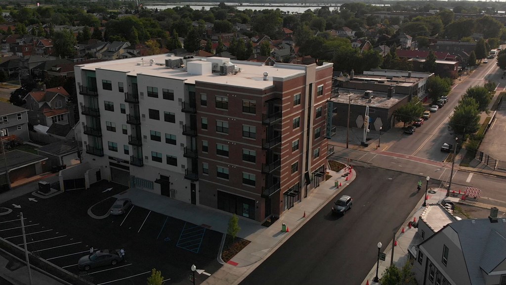 an aerial view of an apartment building in a city