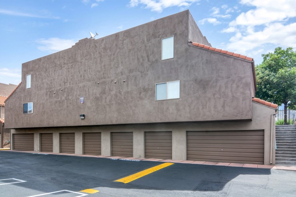 the side of a building with a row of garage doors