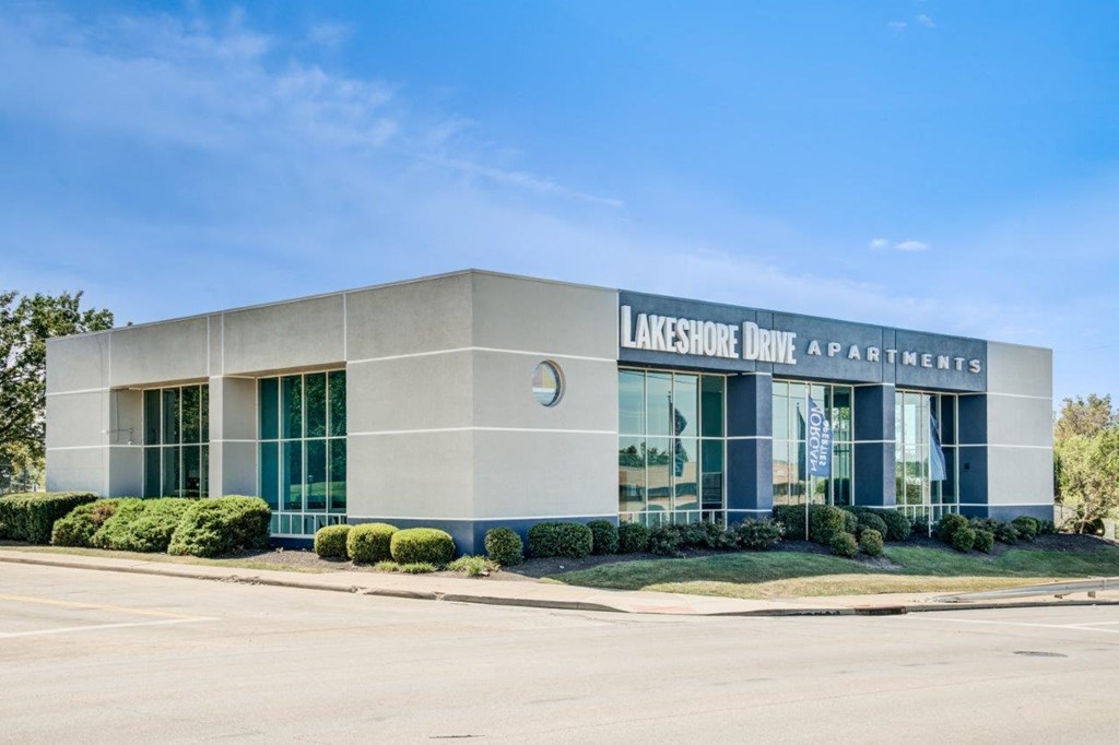 The image shows the exterior of the Lakeshore Drive Apartments building.