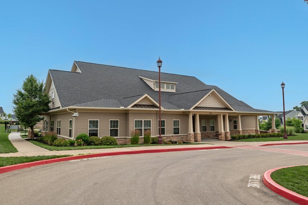 a large house with a street in front of it