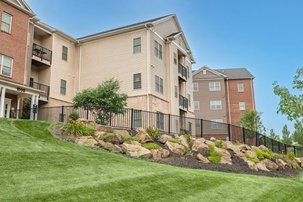 the boulders are in front of an apartment building