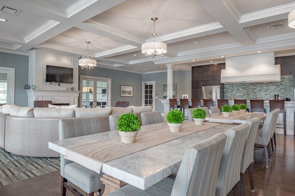 a large dining room with a table and chairs