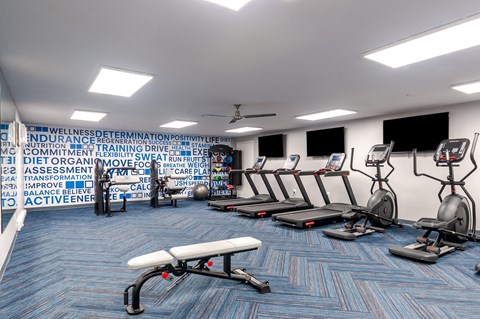 a rendering of a gym with cardio machines and weights