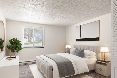 a bedroom with a large bed and a window