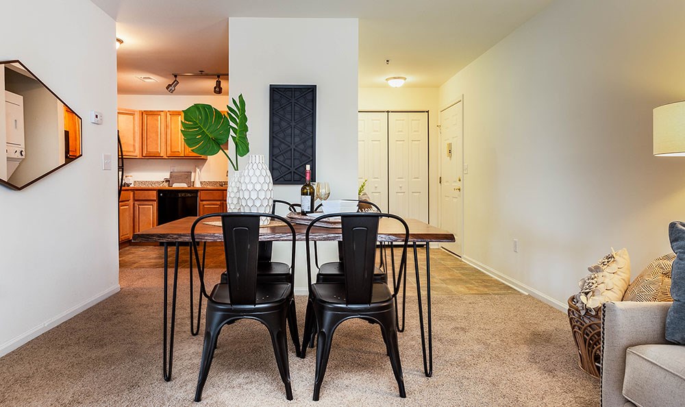a dining room with a table and chairs