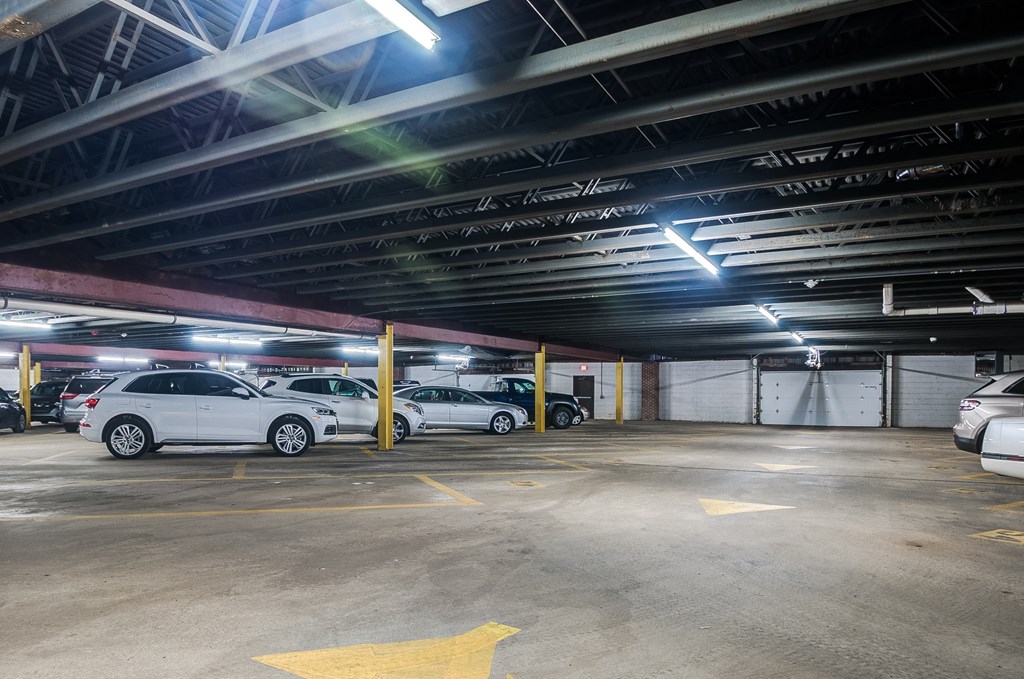 a parking garage with cars parked in it