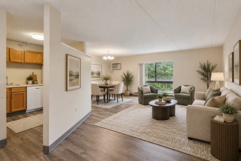 A living room with a couch, chairs, and a coffee table.