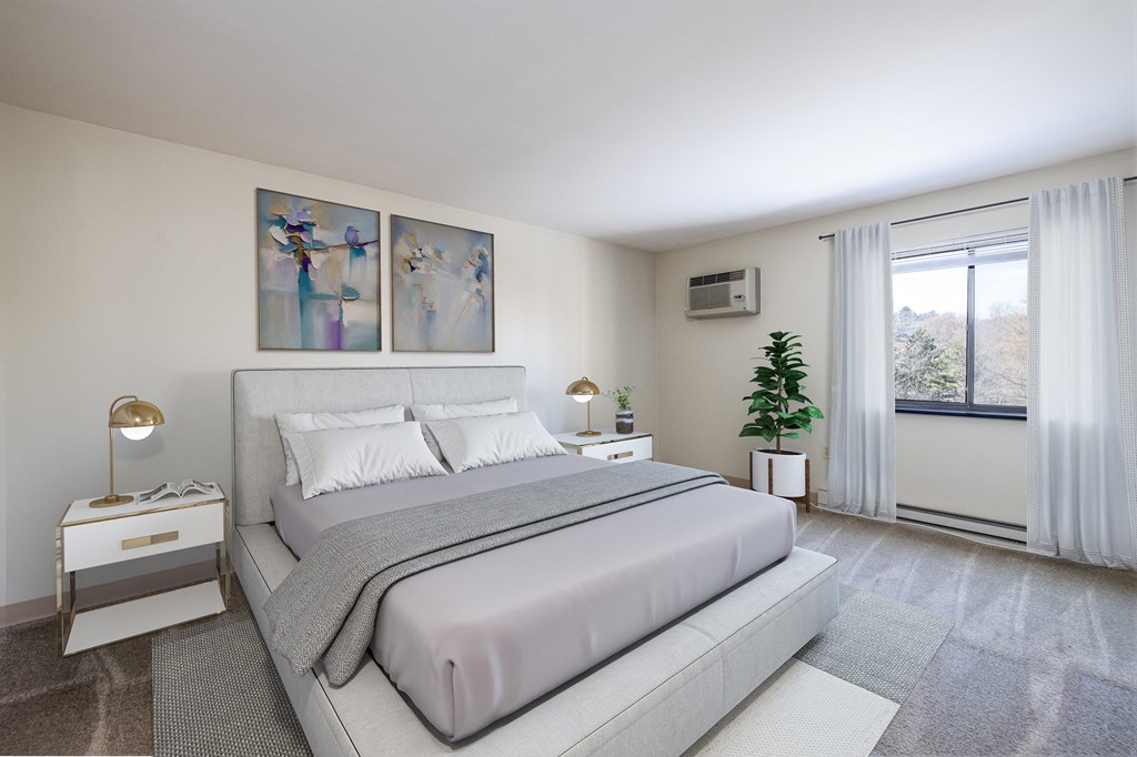 a bedroom with a bed and a window