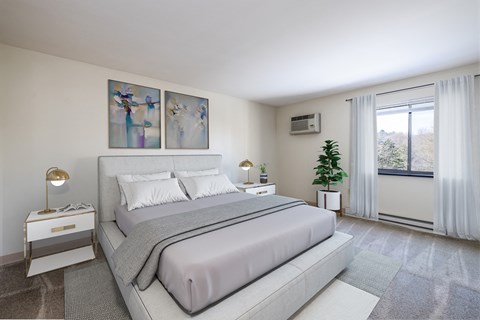 a bedroom with a bed and a window