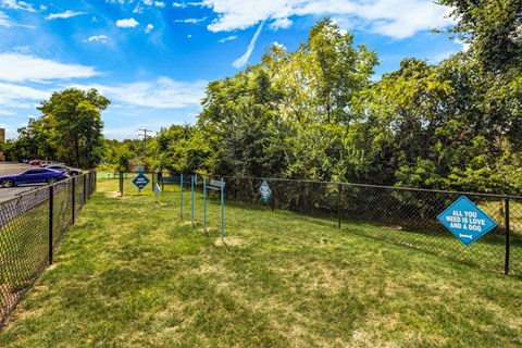 A sign in a yard that says "All you need is love".