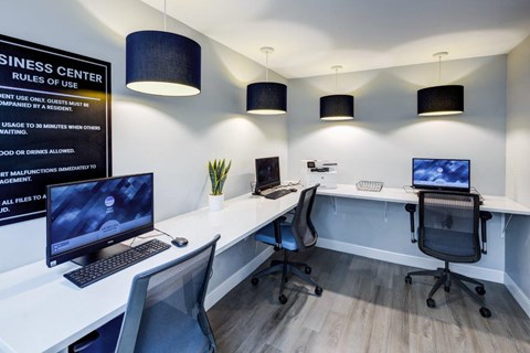 A sign in a business center states the rules of use.