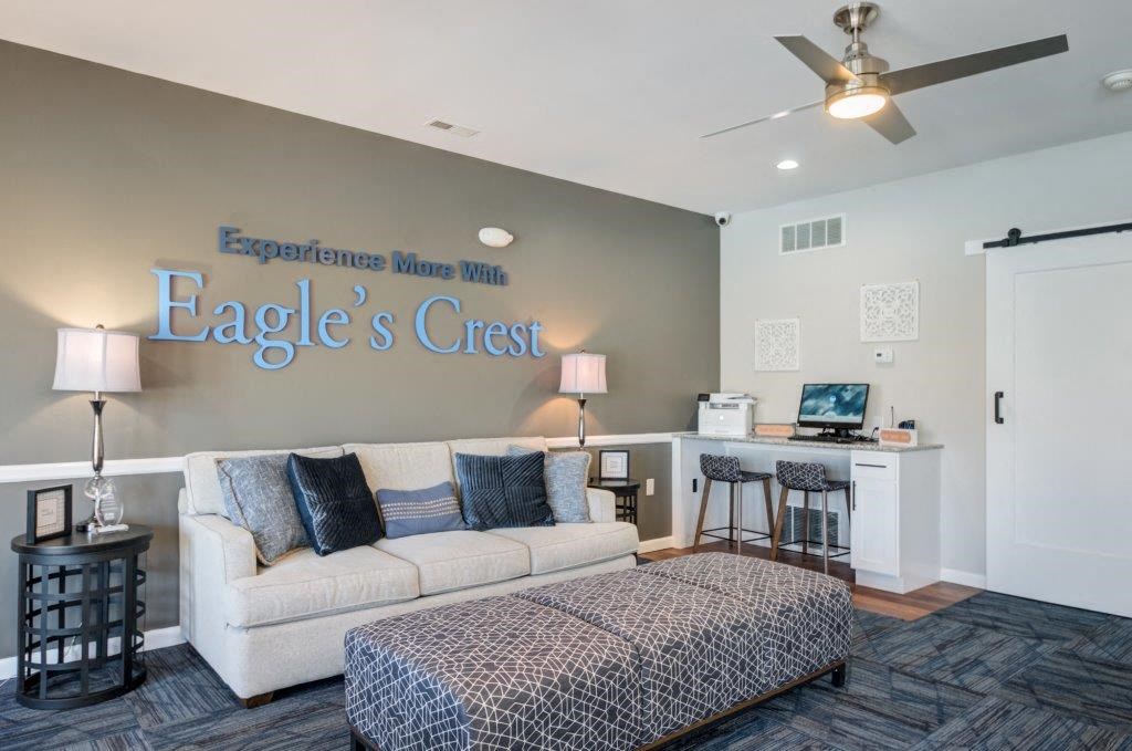 a living room with a couch and a chair and a counter