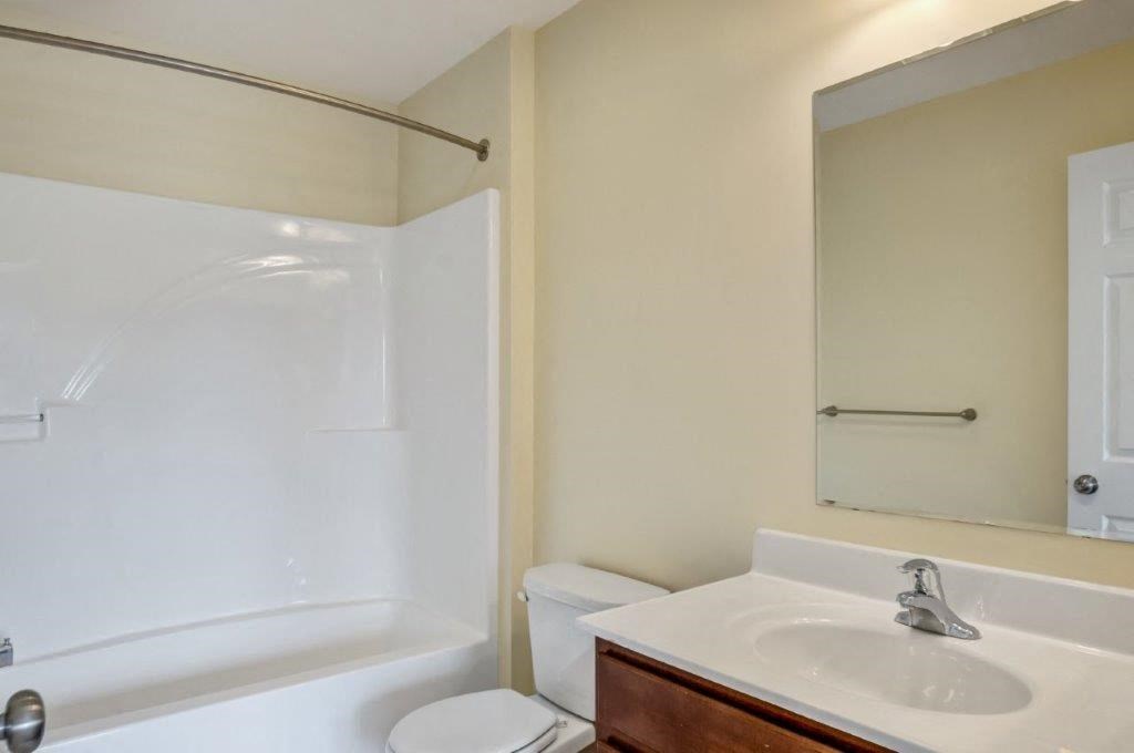 a bathroom with a sink toilet and a shower