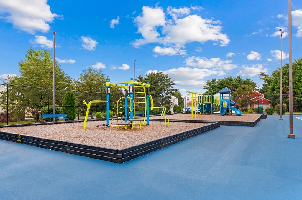 a playground at a park with playground equipment