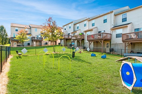 our apartments have a large yard with a playground and a pool