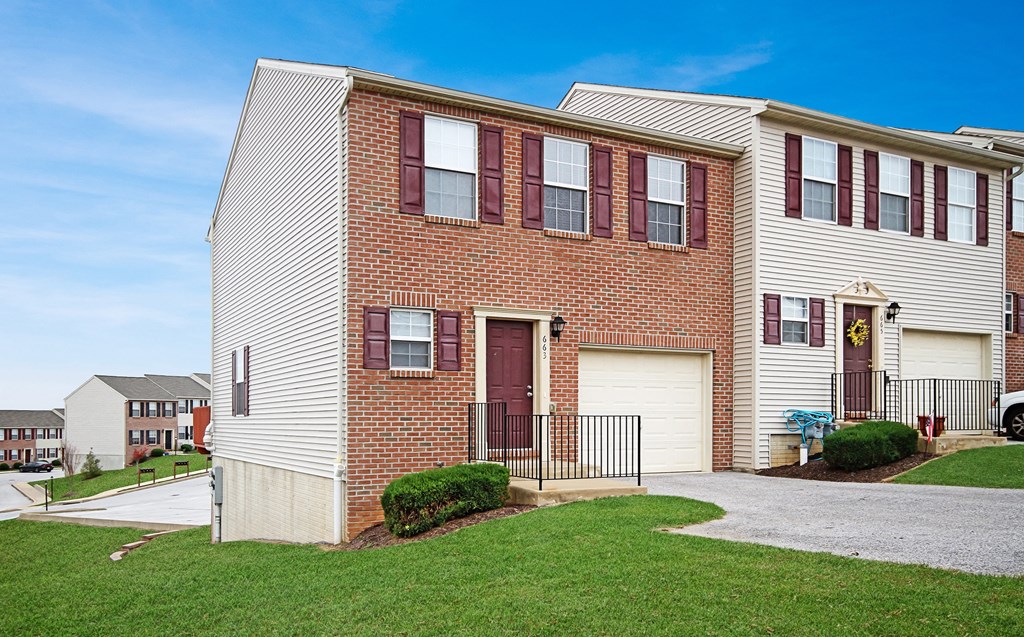 a brick and with a sidewalk in front of it
