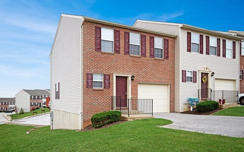 a brick and with a sidewalk in front of it