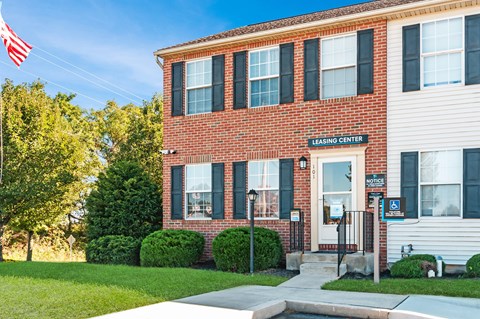 a brick building with an flag in front of it
