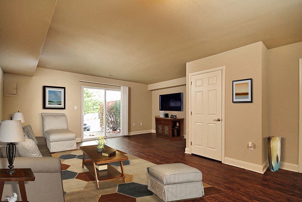 a living room with a door to a patio