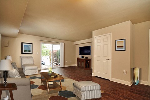 a living room with a door to a patio