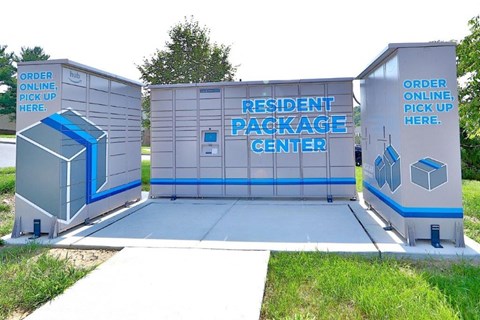 a small building with a toilet and a sign on it
