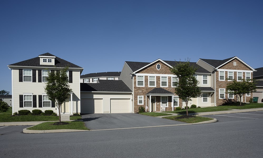 a row of houses on the side of a street