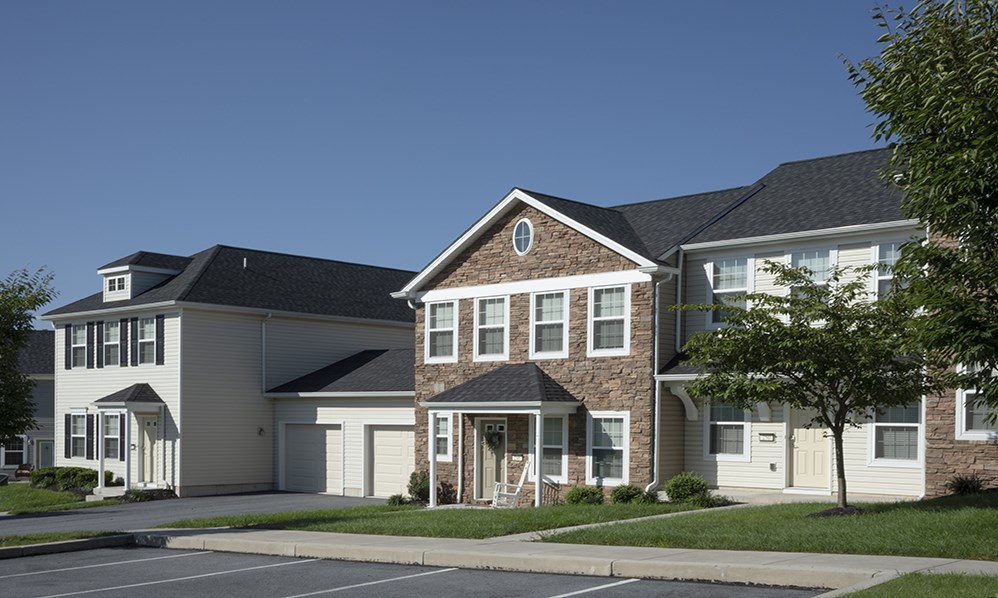 a row of houses on a street in a neighborhood