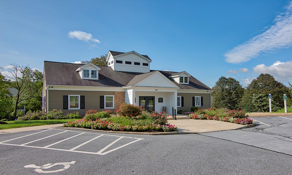 a house with a driveway and a parking lot