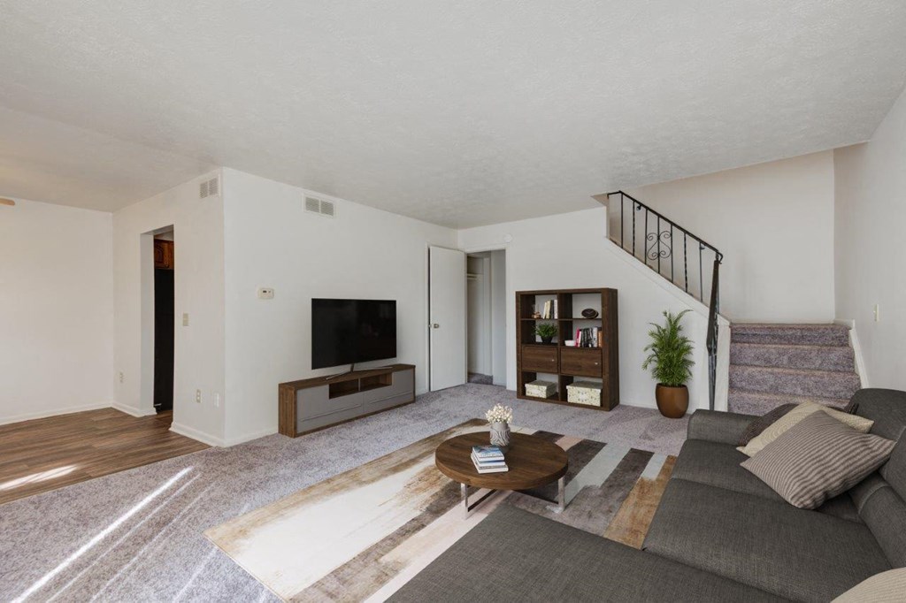 a living room with a couch and a tv