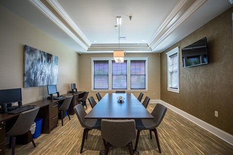 a conference room with a large table and chairs